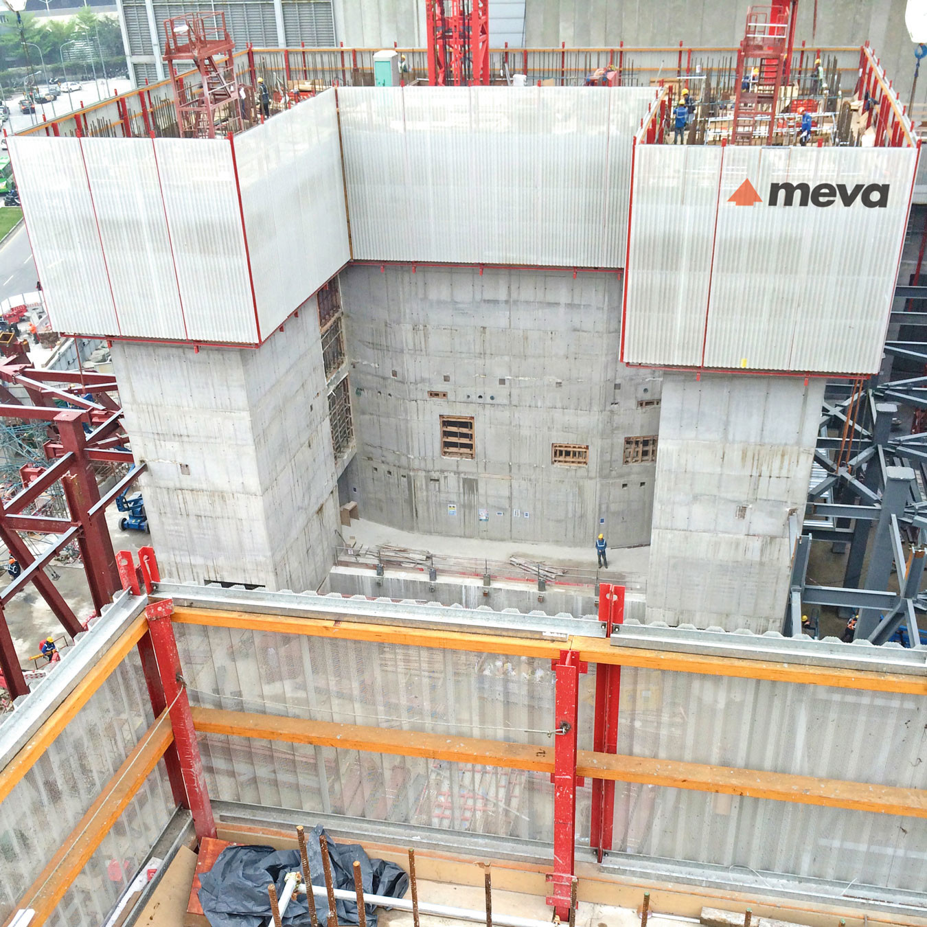 A view across to a concrete building under construction using the MAC automated climbing system