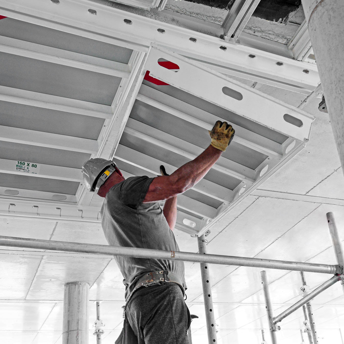 Man holding formwork panel from the inside