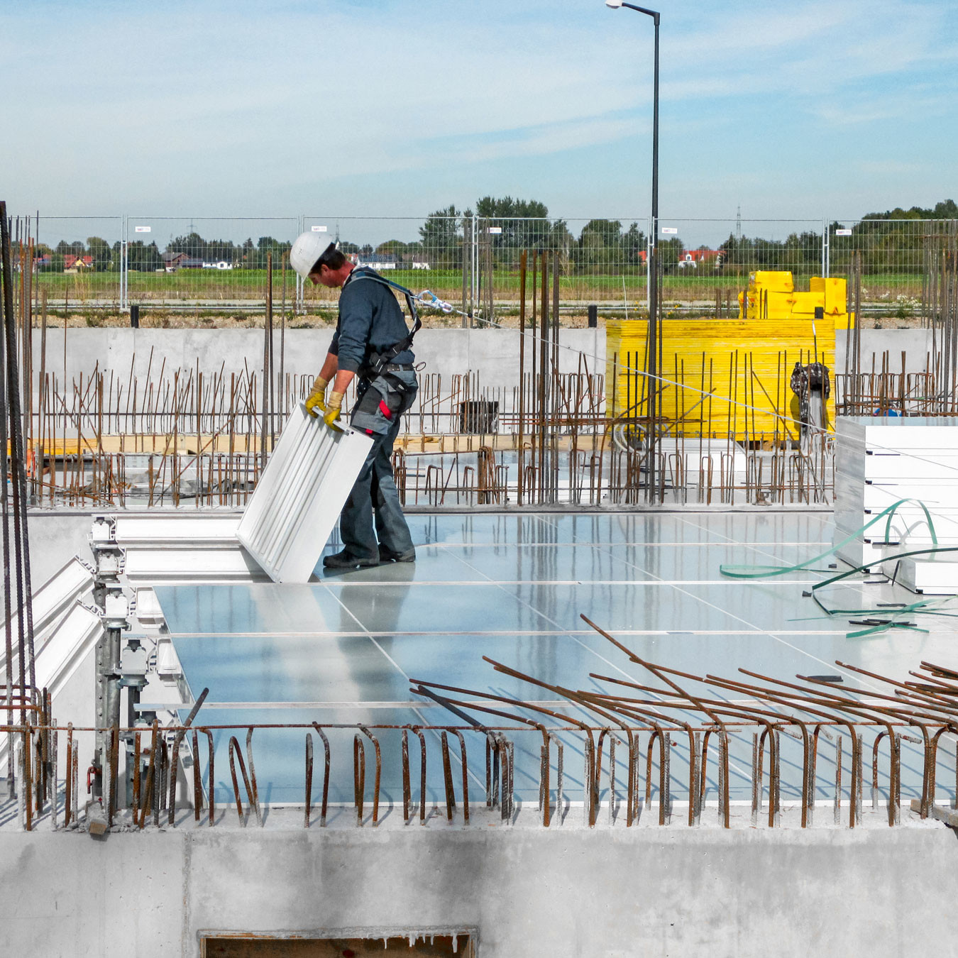 Man laying panels in slab formwork construction