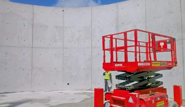 Inside of a curved concrete building which has been constructed using radius formwork