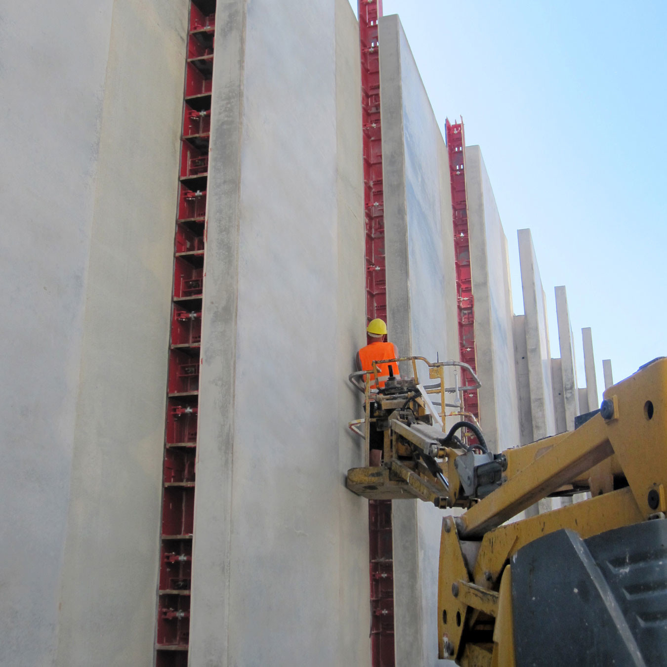 An engineer secures wall formwork end panels