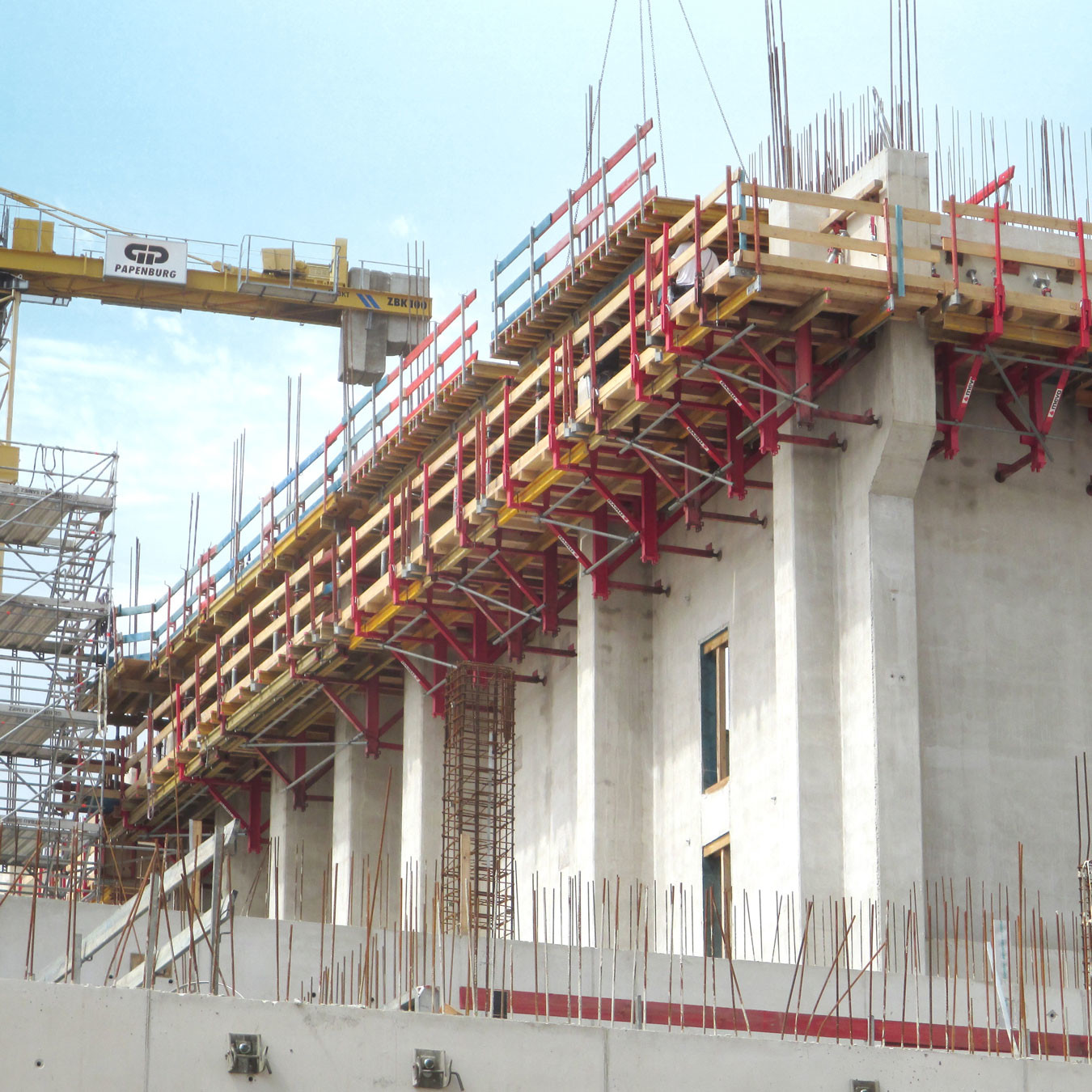 Climbing formwork attached to concrete