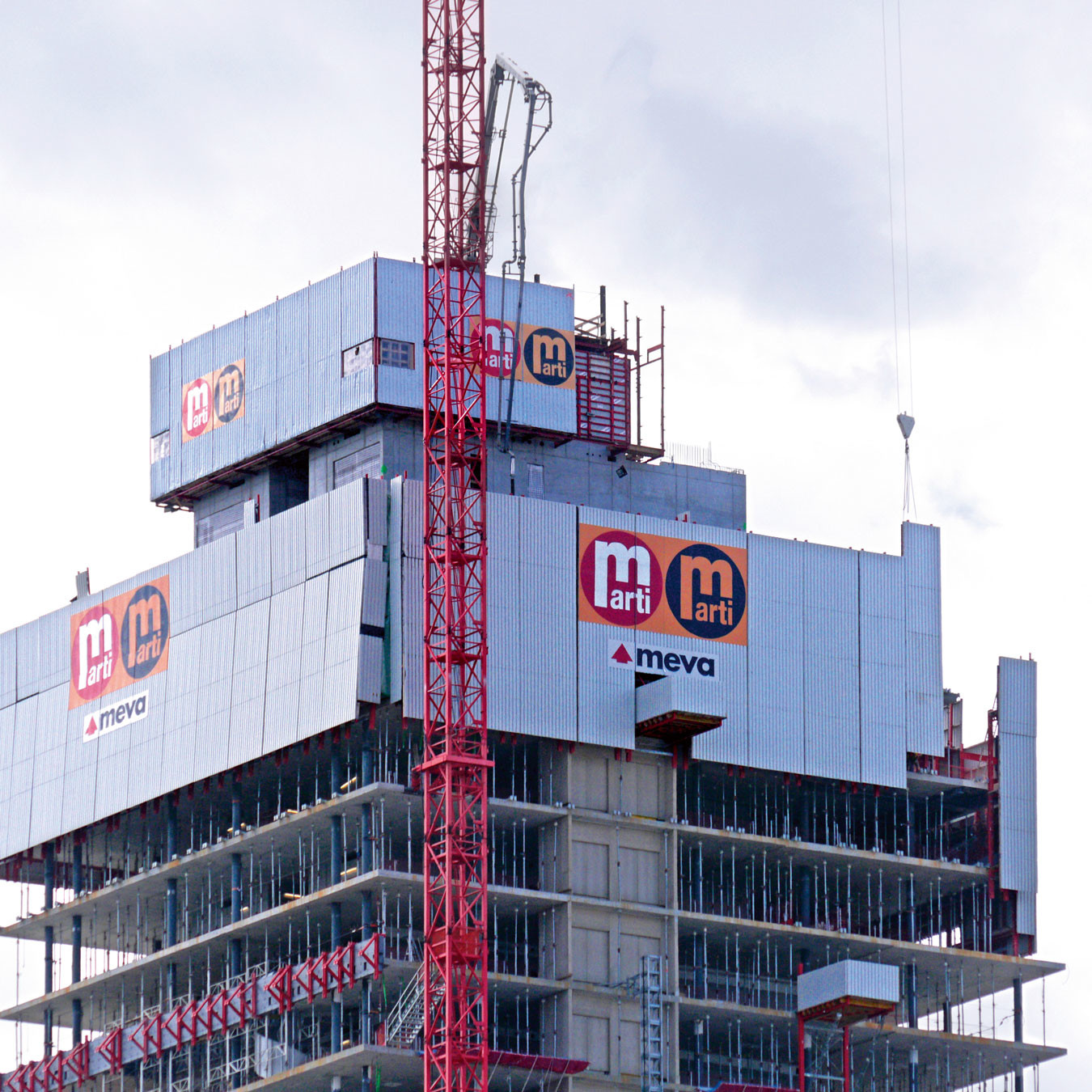 A view of climbing formwork with a screen system fitted