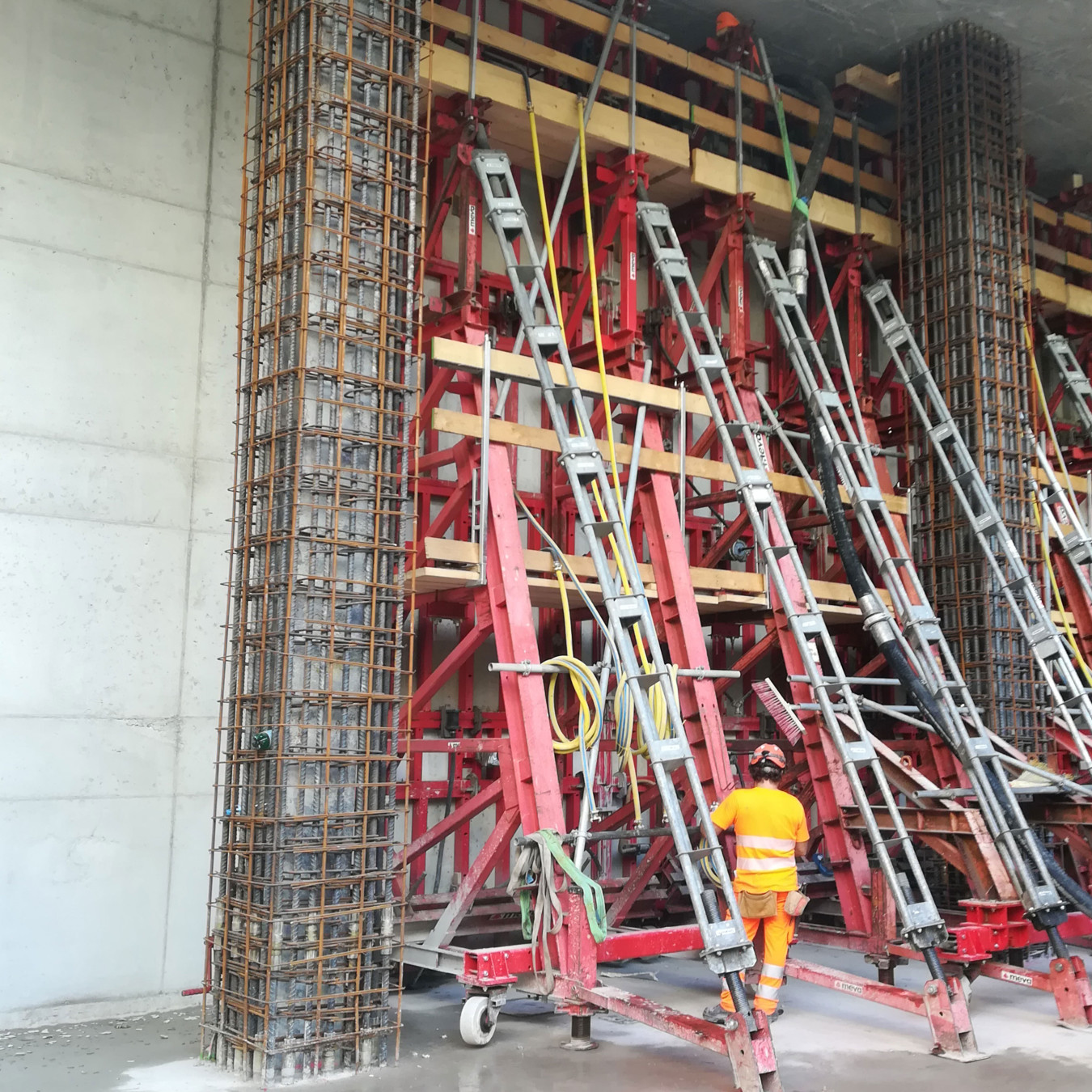 Heavy duty formwork and braces being positioned as part of construction of a concrete wall