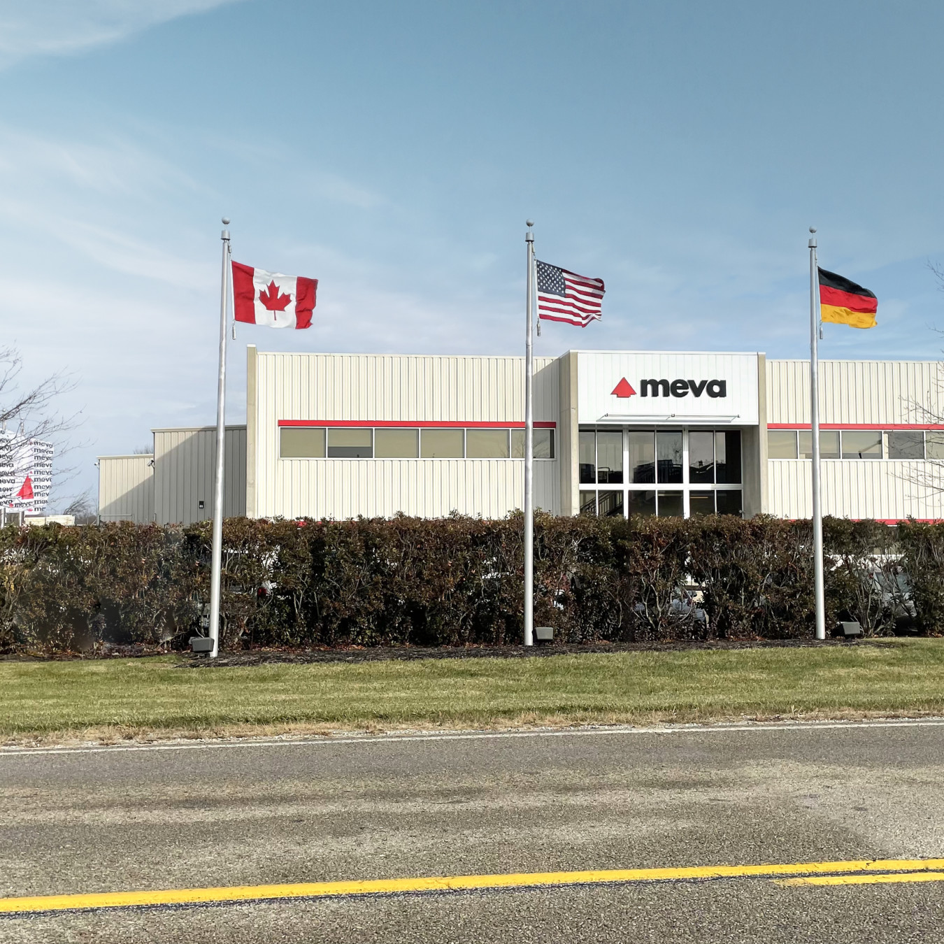 Image of MEVA Formwork Systems offices in USA with Canada USA and Germany flags outside