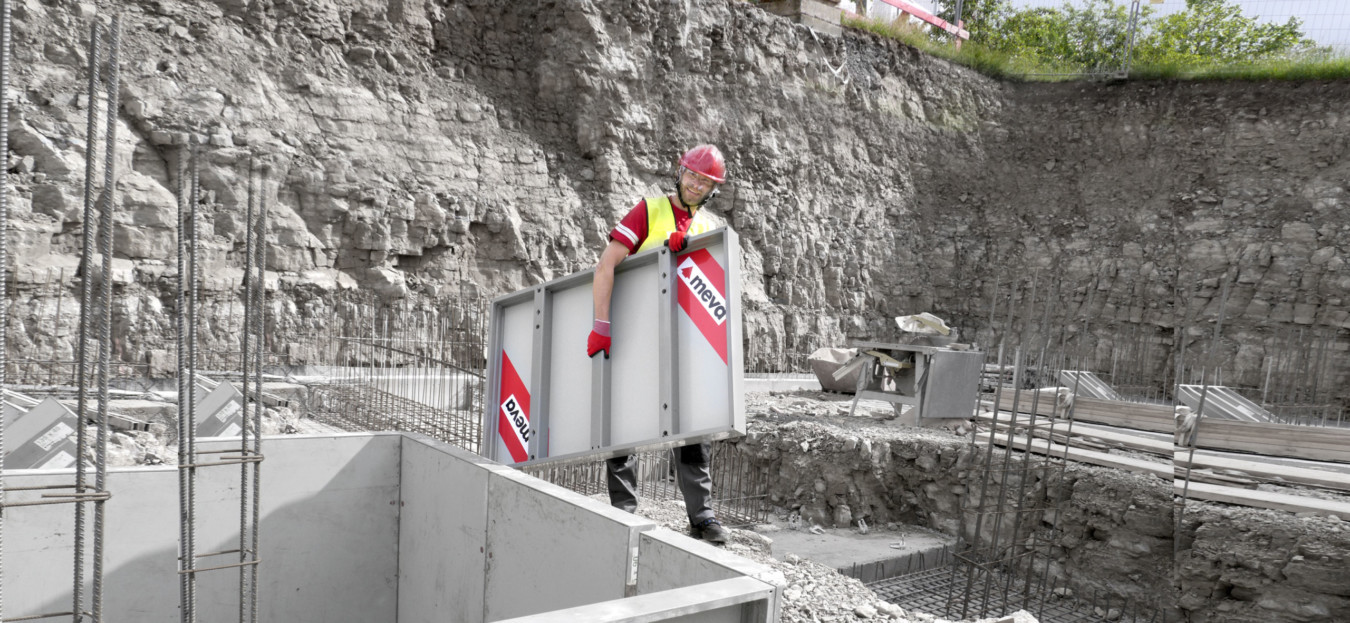Worker carrying a lighweight formwork