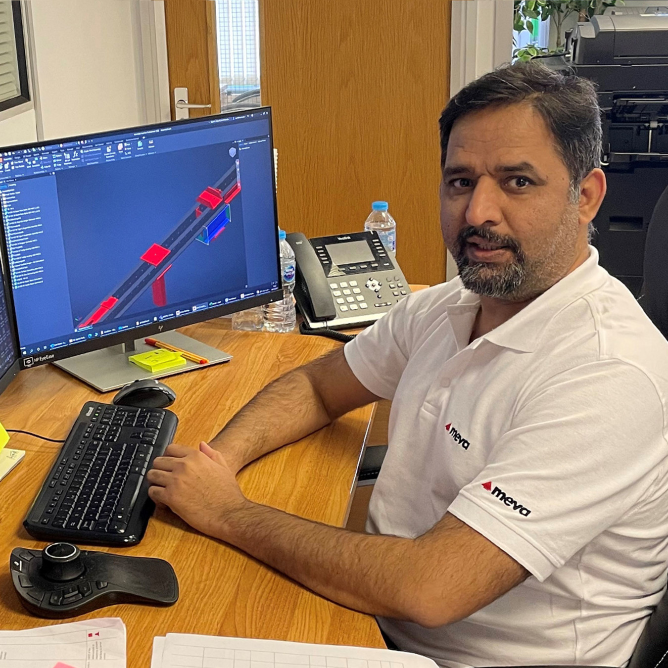 A formwork designer at his desk